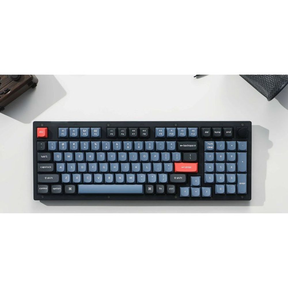 Mechanical keyboard with dark keycaps, frosted black frame, and red accent key