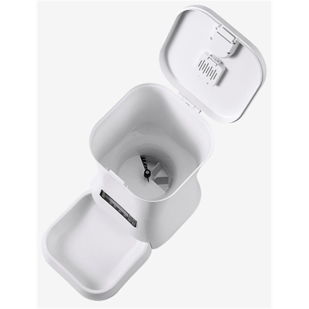 White pet food feeder with hopper and side serving tray opened
