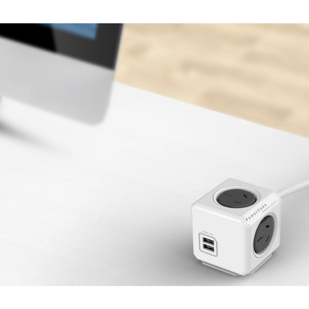 White-grey power cube extender with two AC outlets and one USB port, cable plugged in