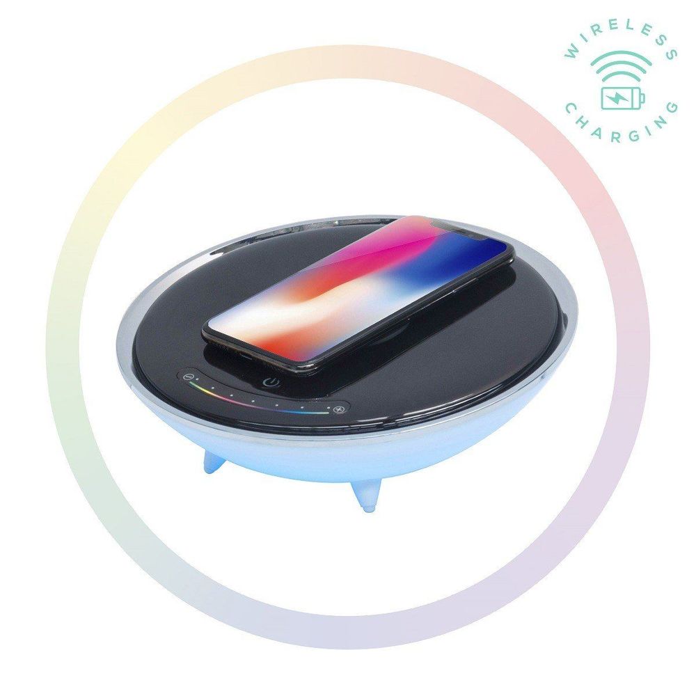 Wireless charging LED table lamp base with phone on dark circular top