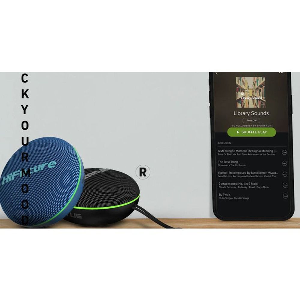 Black and blue portable Bluetooth speakers with green accents next to a phone
