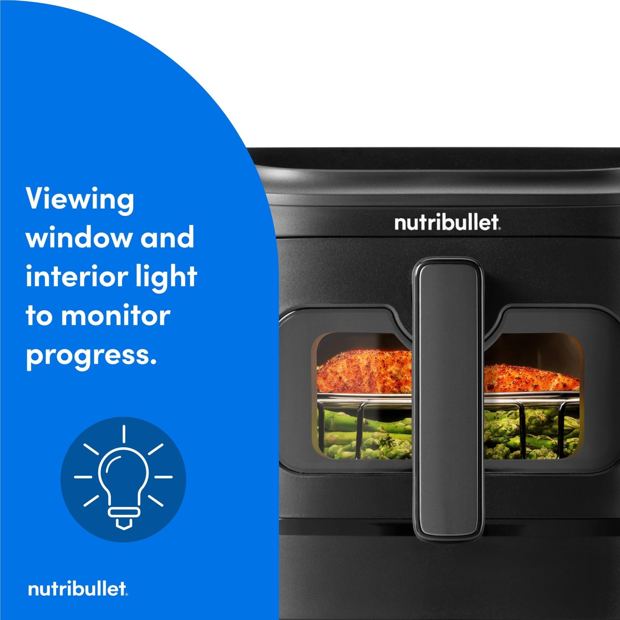 Black air fryer with viewing window and interior light showing food through front glass