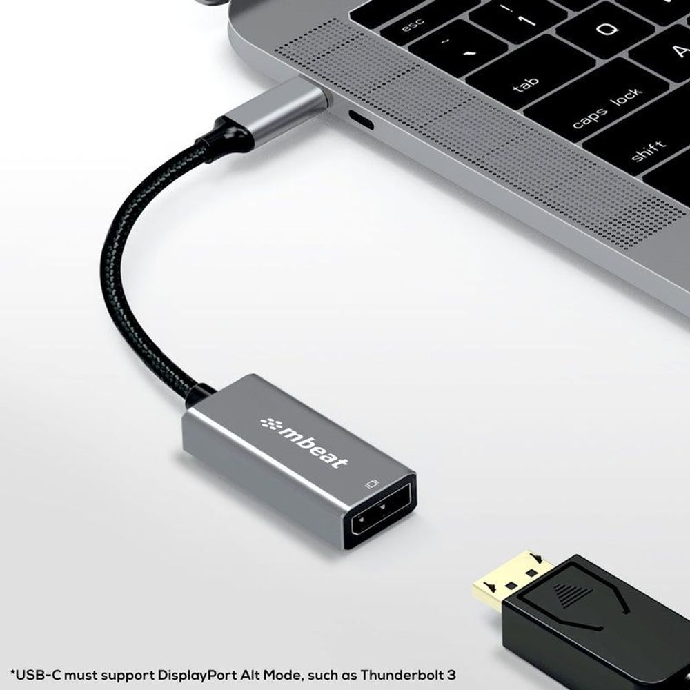 Grey USB-C to DisplayPort adapter connected to a laptop with black braided cable