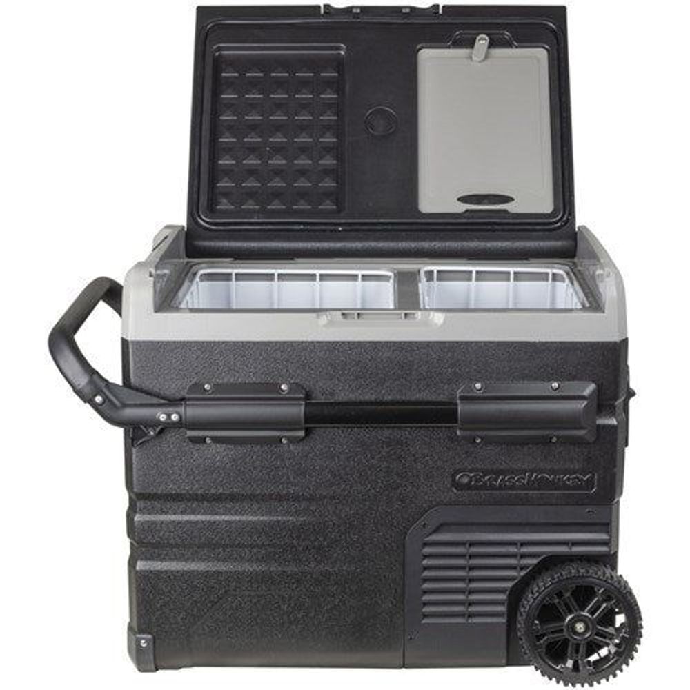 Portable dual-zone fridge/freezer with open lid and ice-cube tray-style baskets