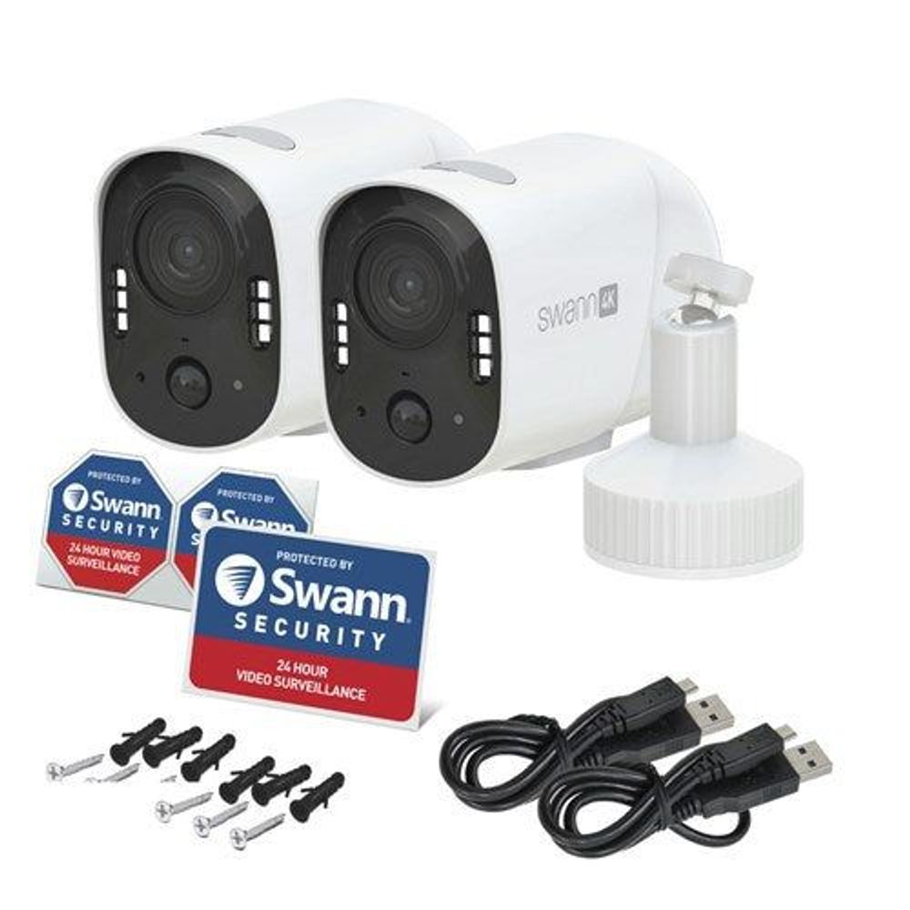 Two white Swann 4K Wi‑Fi security cameras with accessories and cables
