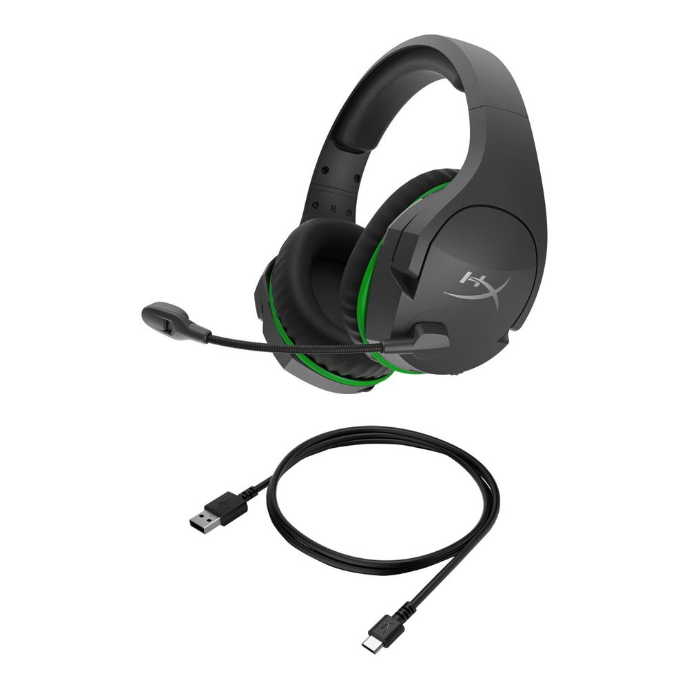 Black wireless gaming headset with green accents plus USB charging cable
